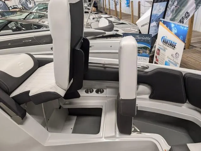 Slide: The Image of 2024 Crownline 280 SS boat interior with sleek seating and modern design. - 21