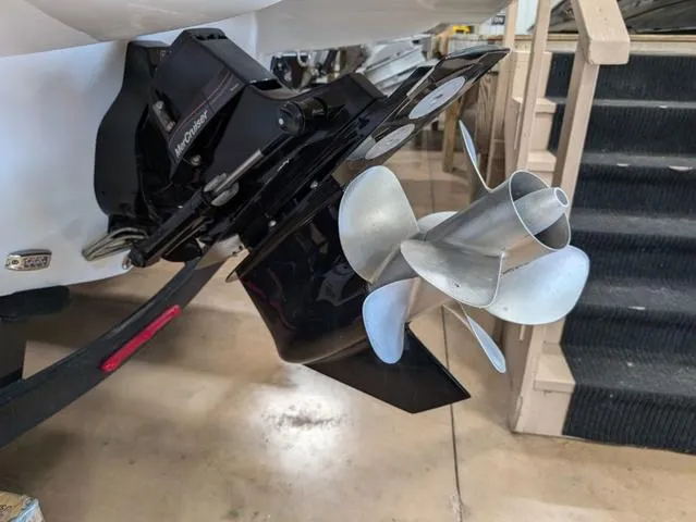 Slide: The Image of 2024 Crownline 280 SS boat propeller and outdrive detail in a showroom. - 27
