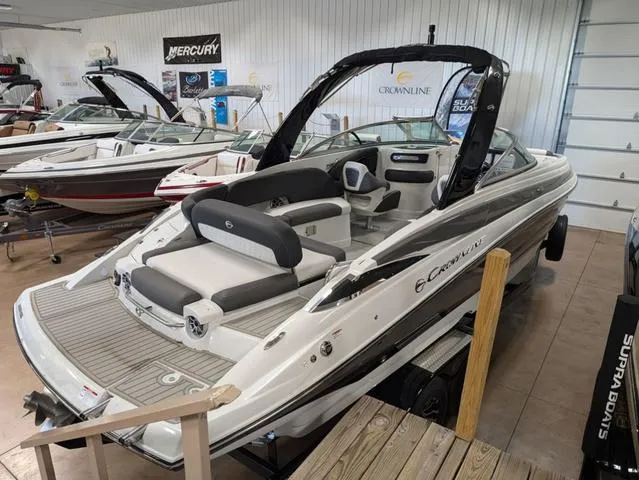 Slide: The Image of 2024 Crownline 280 SS boat in showroom, featuring sleek design and modern interior. - 3