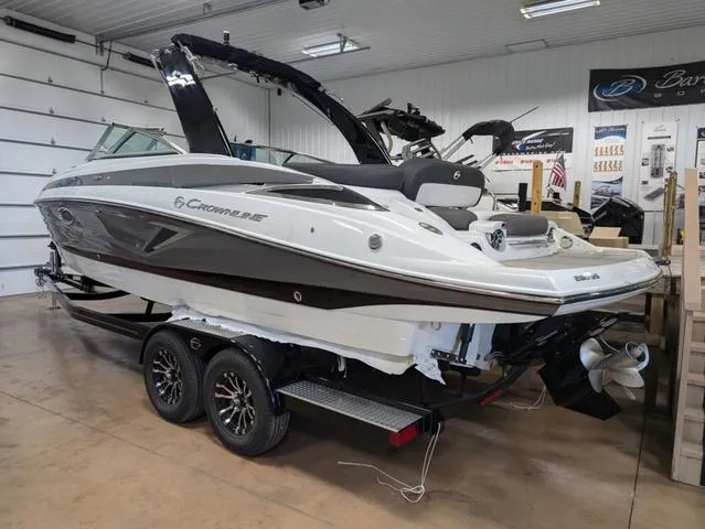 Slide: The Image of 2024 Crownline 280 SS boat on trailer in showroom. - 4