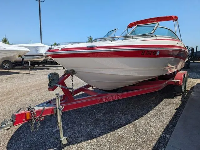 Slide: The Image of 2006 Crownline 220 LS boat on red trailer in outdoor storage area. - 21