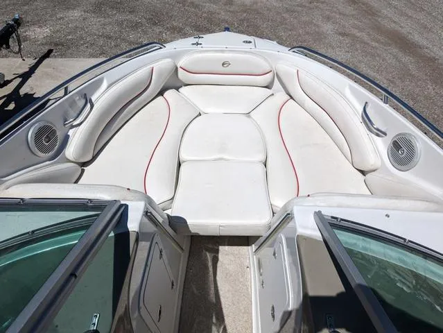 Slide: The Image of 2006 Crownline 220 LS boat interior with white seating and red accents. - 8