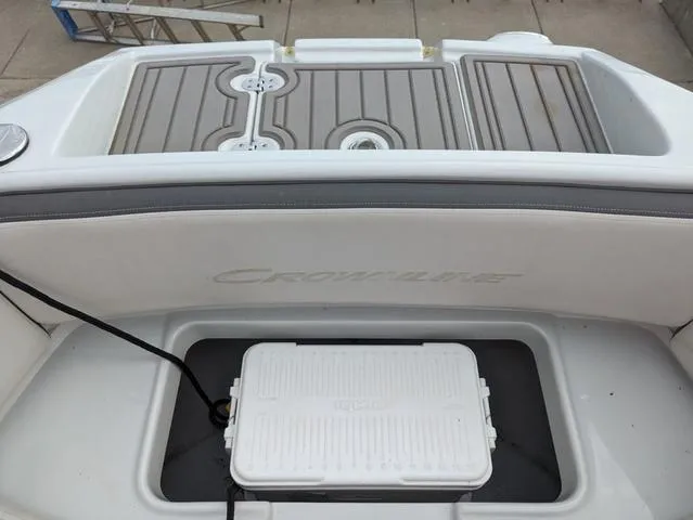 Slide: The Image of 2022 Crownline E235 XS boat with storage compartment and cooler. - 13