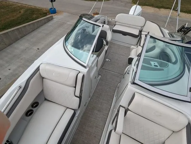 Slide: The Image of 2022 Crownline E235 XS boat interior with plush seating and modern design. - 7