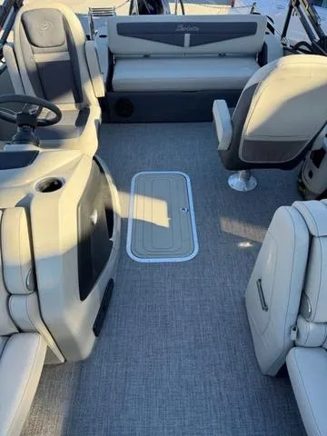 Slide: The Image of 2023 Barletta C22UC boat interior with gray seating and flooring. - 5