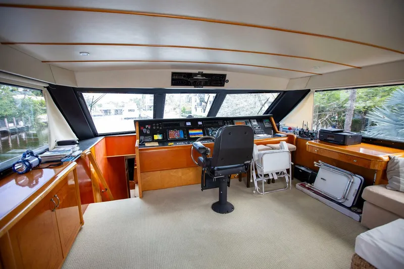 Slide: The Image of Interior of 1999 Tarrab Motoryacht cockpit with modern navigation equipment and seating. - 22