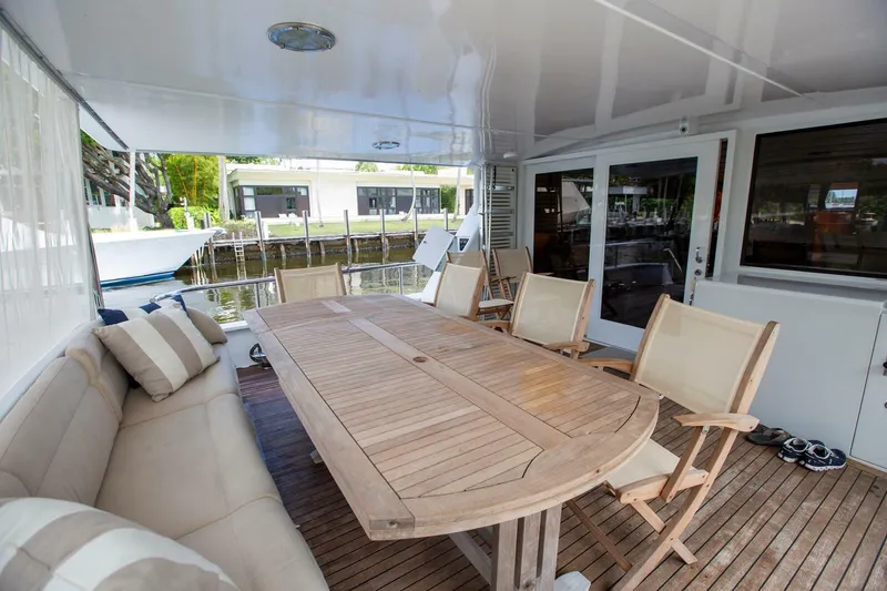 Slide: The Image of Spacious deck of 1999 Tarrab motoryacht with wooden table and chairs. - 35