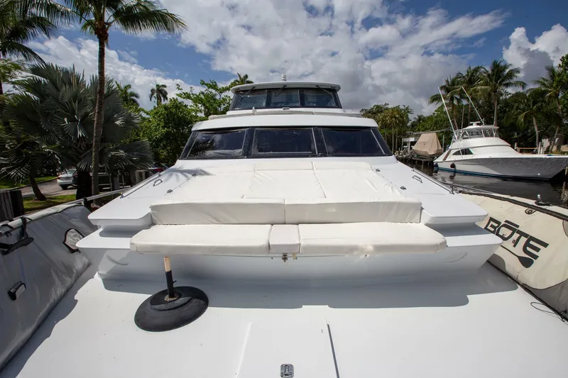 Slide: The Image of Tarrab 1999 motoryacht with white deck, docked under a partly cloudy sky. - 38