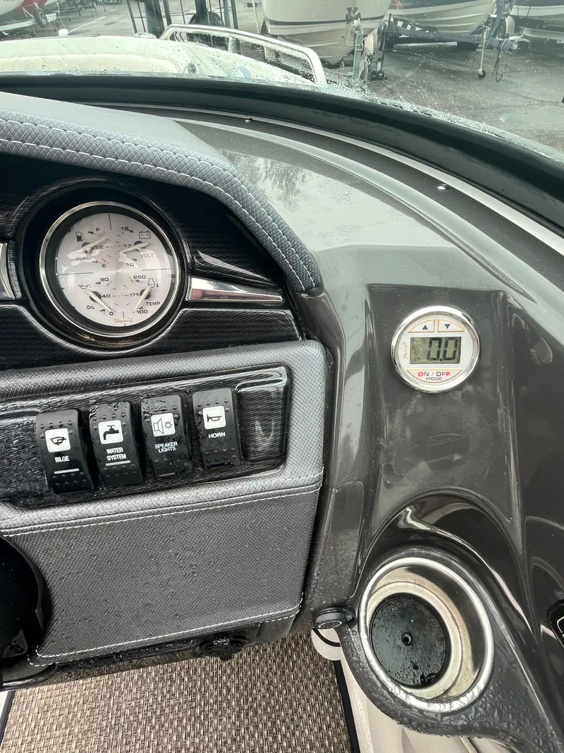 Slide: The Image of 2017 Monterey 224FS boat dashboard with gauges and controls. - 18