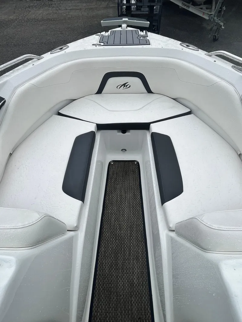 Slide: The Image of 2017 Monterey 224FS boat interior with white seating and black accents. - 21