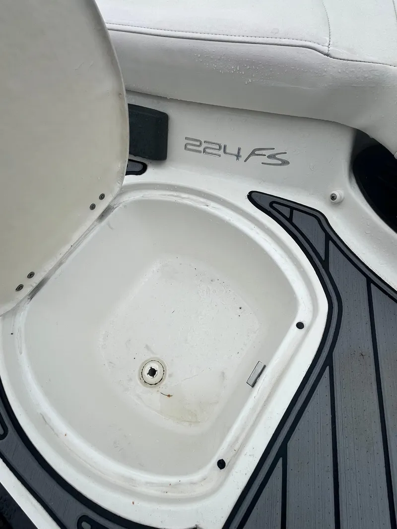 Slide: The Image of 2017 Monterey 224FS boat storage compartment with open lid. - 4