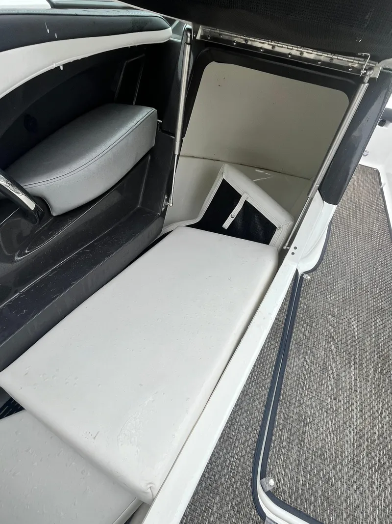 Slide: The Image of 2017 Monterey 224FS boat interior with seating and storage compartment. - 9