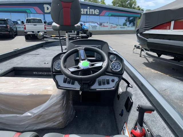 Slide: The Image of 2024 Ranger RT178 boat interior with steering wheel and dashboard controls. - 3