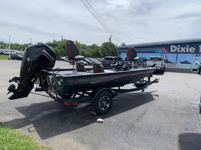 Slide: The Image of 2024 Ranger RT178 boat with motor on trailer in parking lot. - 4