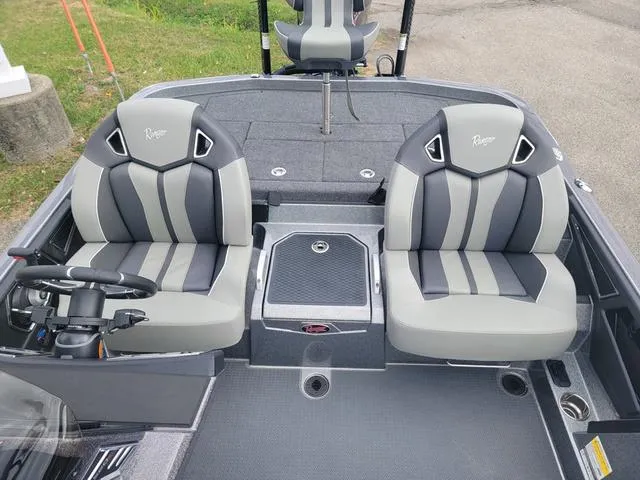 Slide: The Image of 2025 Ranger Z520R Ranger Cup boat interior with dual gray seats and steering console. - 10