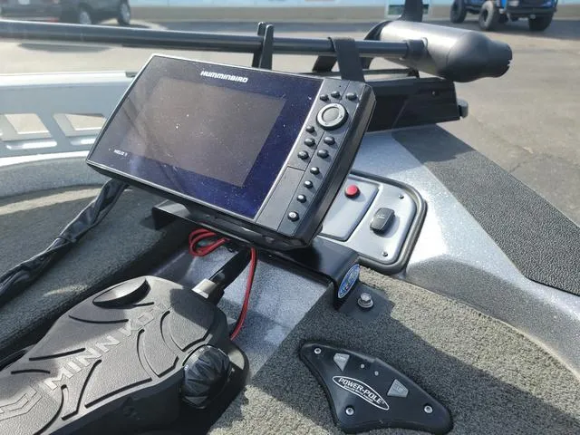 Slide: The Image of 2015 Skeeter ZX200 boat dashboard with Humminbird fish finder and Minn Kota controls. - 3