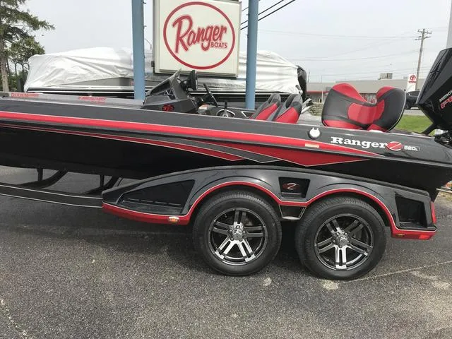 Slide: The Image of 2019 Ranger Z520L boat with red accents on a trailer. - 2