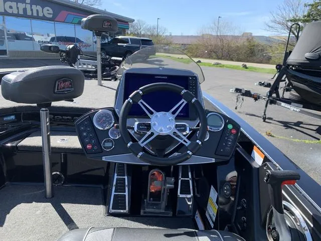 Slide: The Image of 2020 Ranger Z520C boat dashboard with steering wheel and control panel. - 4