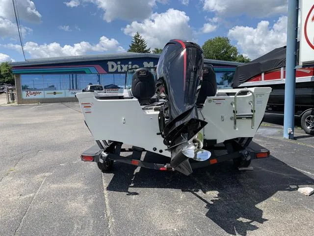 Slide: The Image of 2024 Ranger VS1682 boat with outboard motor in parking lot. - 4