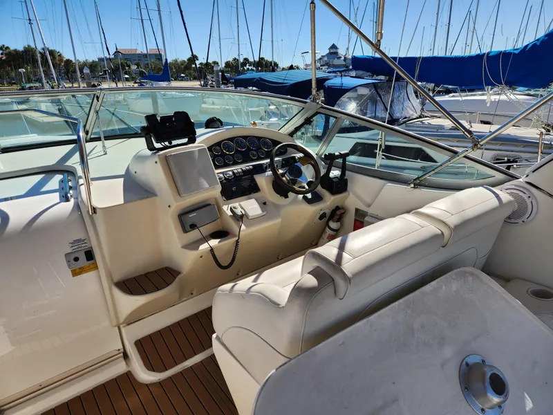 Slide: The Image of 1999 Cruisers Yachts 3375 Esprit cockpit with steering wheel and control panel. - 13