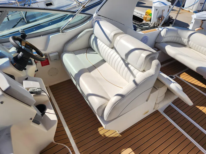 Slide: The Image of 1999 Cruisers Yachts 3375 Esprit interior with white leather seating and wooden flooring. - 14