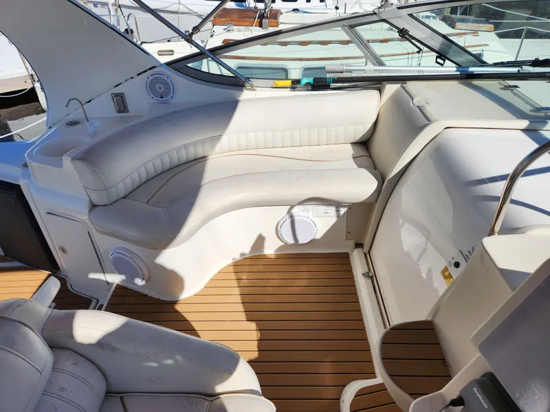 Slide: The Image of 1999 Cruisers Yachts 3375 Esprit interior with white seating and wooden flooring. - 15