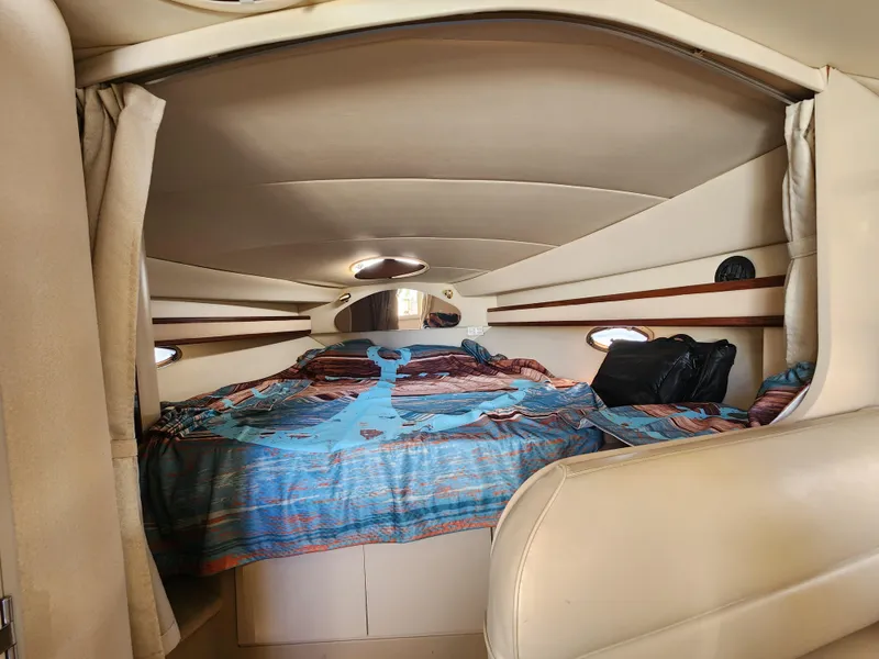 Slide: The Image of Interior cabin of 1999 Cruisers Yachts 3375 Esprit with cozy bed and nautical decor. - 18