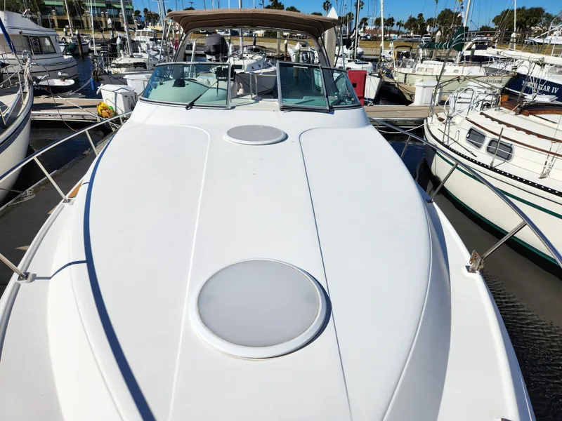 Slide: The Image of 1999 Cruisers Yachts 3375 Esprit docked at marina, view of spacious deck. - 27