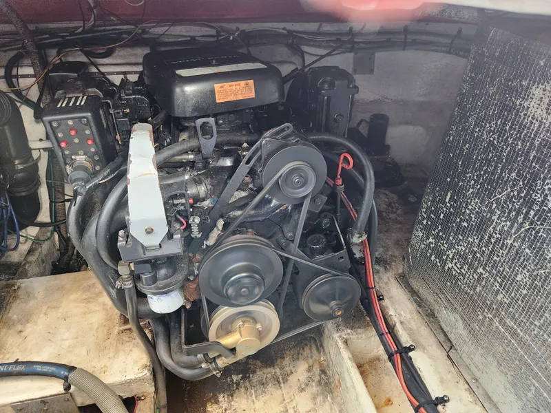 Slide: The Image of Engine compartment of 1999 Cruisers Yachts 3375 Esprit, showcasing mechanical components. - 30