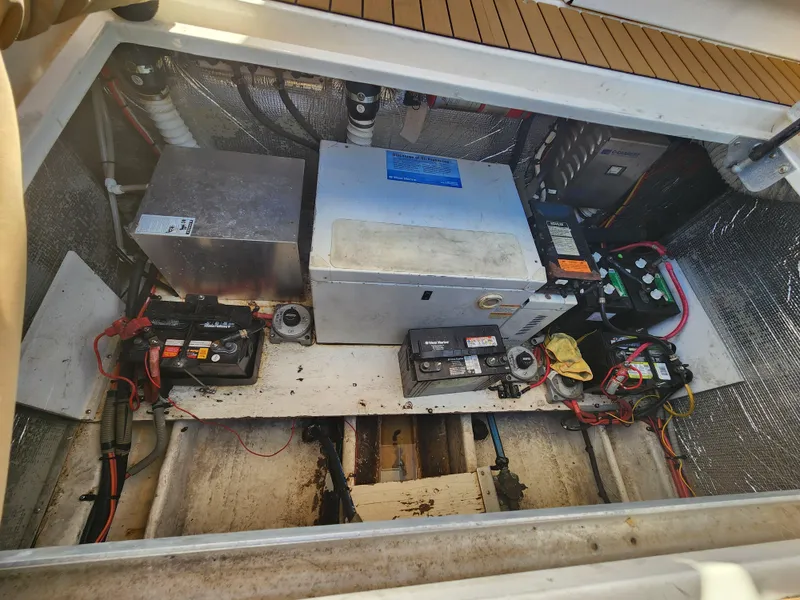 Slide: The Image of Engine compartment of 1999 Cruisers Yachts 3375 Esprit with batteries and equipment. - 31