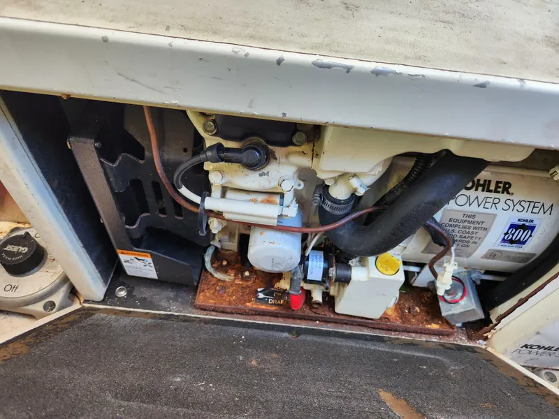 Slide: The Image of 1999 Cruisers Yachts 3375 Esprit engine compartment with Kohler power system. - 32