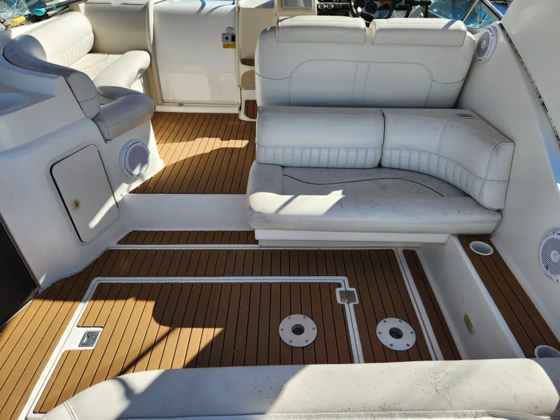 Slide: The Image of 1999 Cruisers Yachts 3375 Esprit interior with white seating and teak flooring. - 7