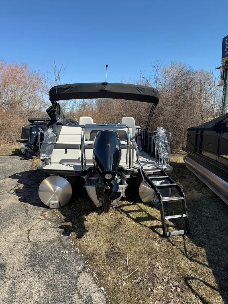 Slide: The Image of 2025 Harris Cruiser 210 pontoon boat with outboard motor. - 12