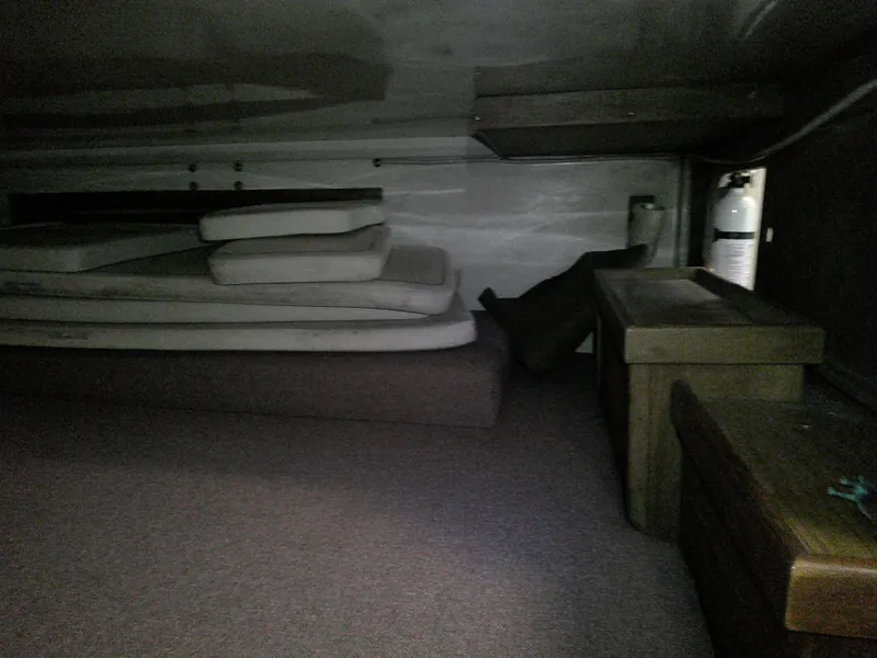 Slide: The Image of Interior cabin of a 1984 Catalina 36' sloop with cushions and storage. - 10
