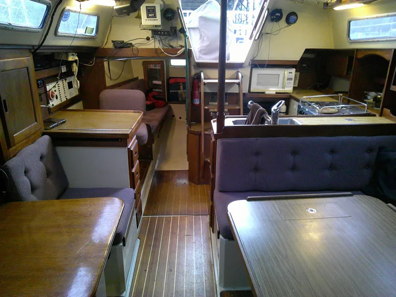 Slide: The Image of Interior of a 1984 Catalina 36' sloop with wood furnishings and modern amenities. - 6