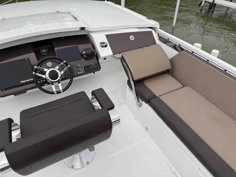 Slide: The Image of 2018 Galeon 560 Sky yacht cockpit with modern steering and seating. - 16