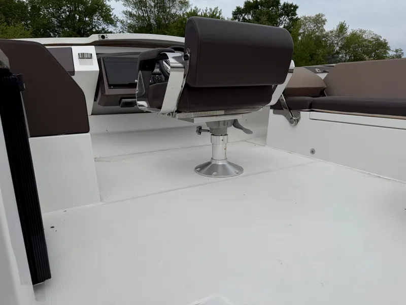 Slide: The Image of 2018 Galeon 560 Sky yacht cockpit with modern helm and seating. - 19