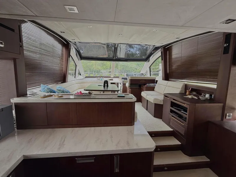 Slide: The Image of Luxurious interior of 2018 Galeon 560 Sky yacht with modern furnishings and panoramic windows. - 23