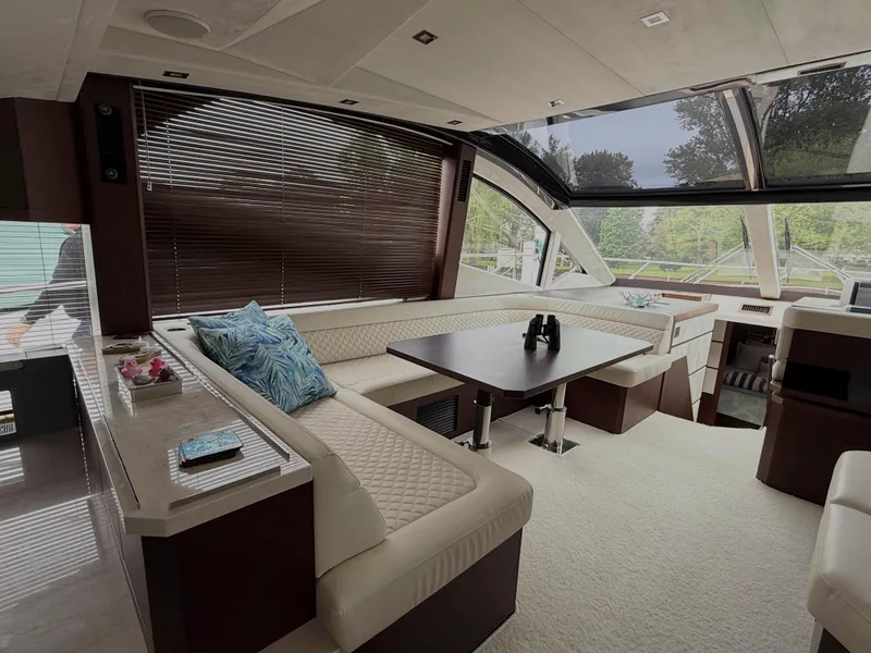 Slide: The Image of Luxurious interior of 2018 Galeon 560 Sky yacht with elegant seating and panoramic windows. - 24