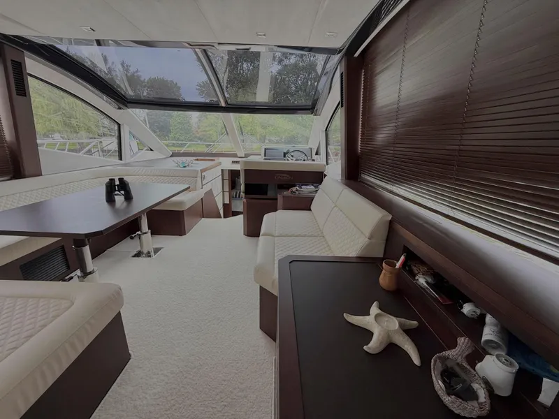 Slide: The Image of Luxurious interior of 2018 Galeon 560 Sky yacht with modern seating and panoramic windows. - 25