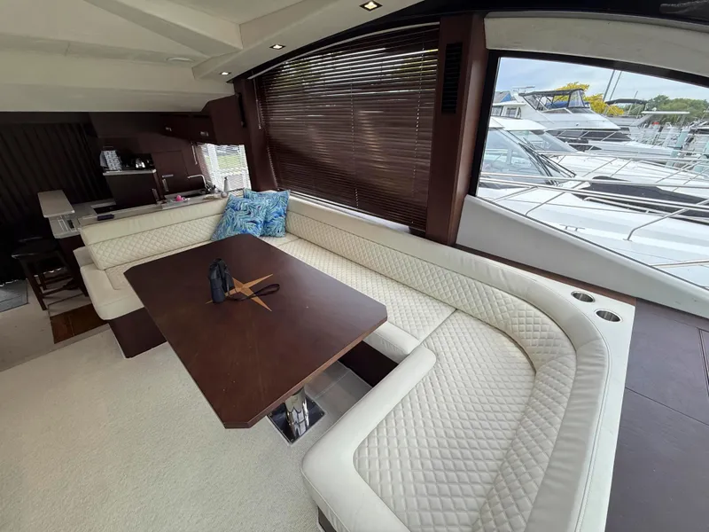 Slide: The Image of Luxurious interior of 2018 Galeon 560 Sky yacht with elegant seating and table. - 44