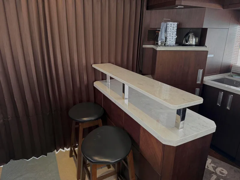 Slide: The Image of Luxurious interior of 2018 Galeon 560 Sky yacht with modern bar and stools. - 48