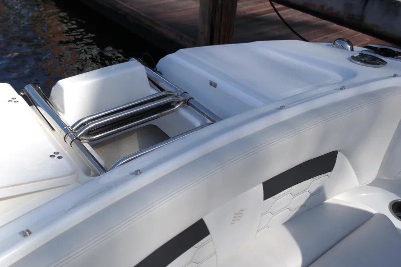 Slide: The Image of 2022 Four Winns HD3 boat interior with sleek white seating and stainless steel details. - 27