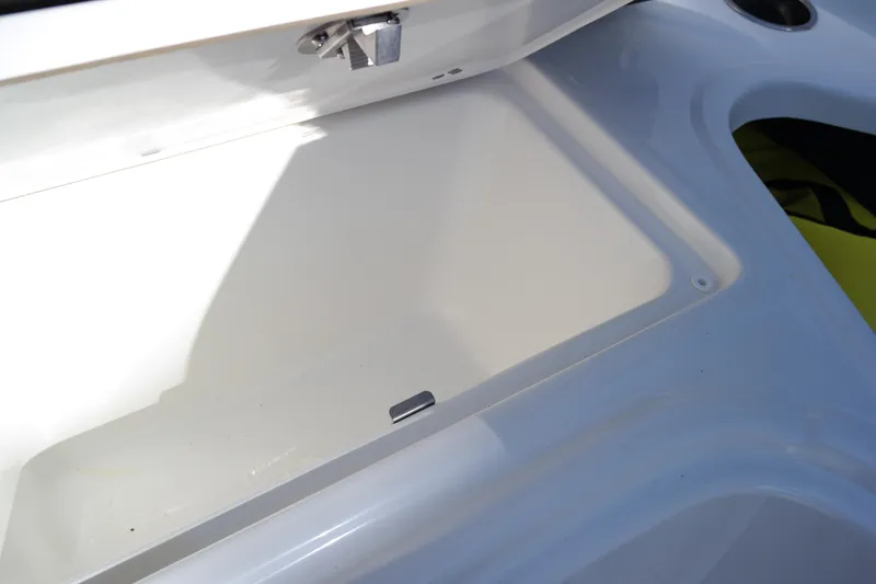 Slide: The Image of Storage compartment of 2022 Four Winns HD3 boat, open and empty. - 29