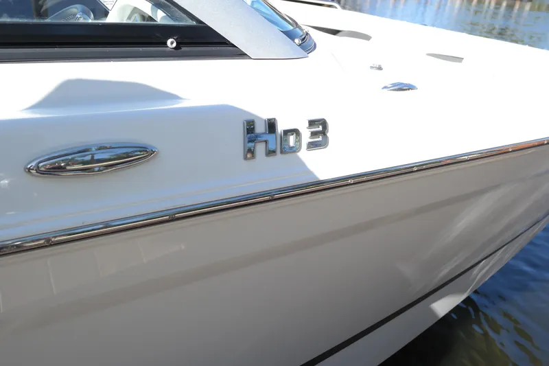 Slide: The Image of 2022 Four Winns HD3 boat side view with logo detail. - 3