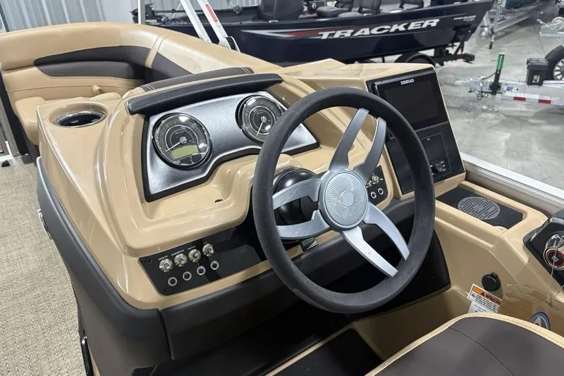 Slide: The Image of 2025 Barletta C22QC boat dashboard with steering wheel and control panel. - 18