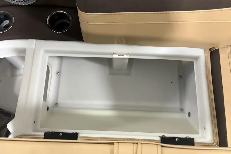 Slide: The Image of Interior storage compartment of 2025 Barletta C22QC boat with cup holders. - 24