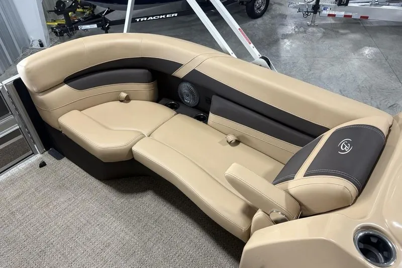 Slide: The Image of Luxurious seating in 2025 Barletta C22QC pontoon boat, featuring beige and brown upholstery. - 3