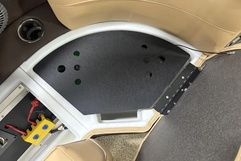 Slide: The Image of 2025 Barletta C22QC boat interior with seating and electrical components. - 31