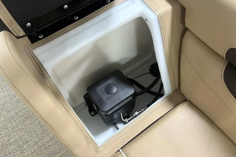 Slide: The Image of Storage compartment in 2025 Barletta C22QC boat with beige seating and equipment. - 32